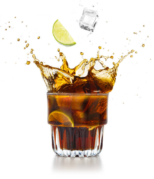 istock splashing rum and cola cocktail on white background 1167573386