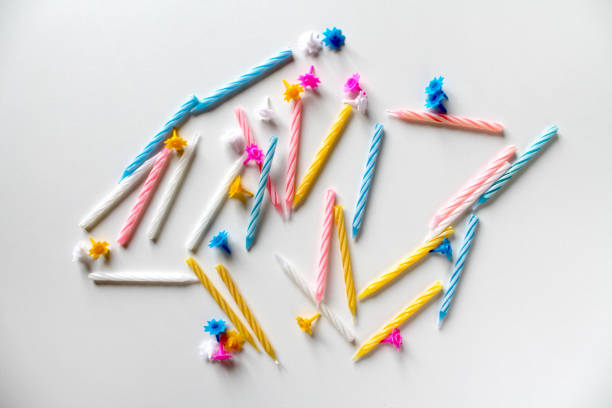 istock Festive background with bright colorful birthday candles on white background 1167573454