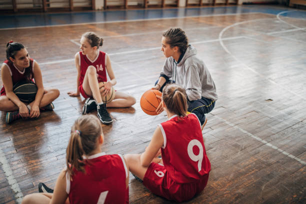 istock Coach and young  basketball team 1167577696