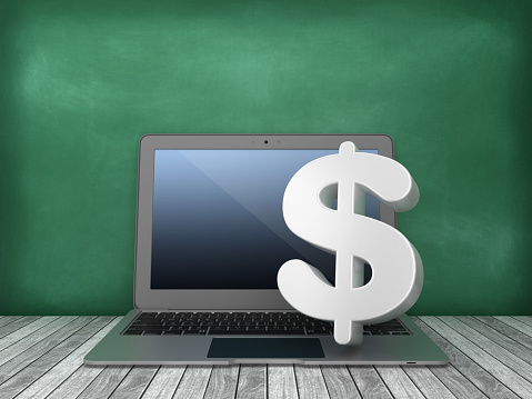 Laptop with Dollar Sign on Chalkboard Background - 3D Rendering