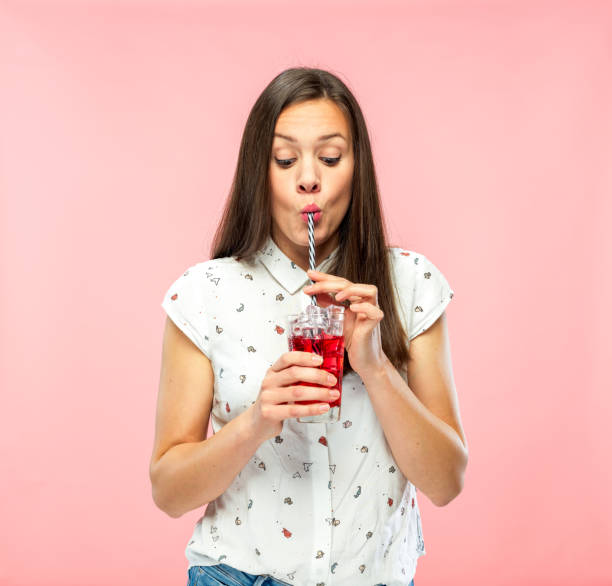 istock Attractive Young Woman Enjoying Drinking Ice Tea with Reusable Straw 1167579310