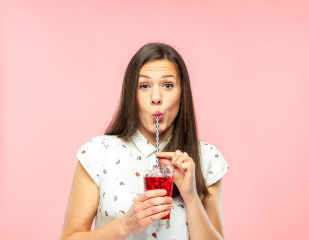 istock Attractive Young Woman Enjoying Drinking Ice Tea with Reusable Straw 1167579314