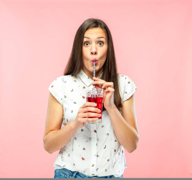 istock Attractive Young Woman Enjoying Drinking Ice Tea with Reusable Straw 1167579341