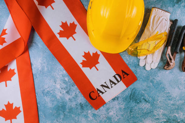istock Canada happy labor day greeting card and yellow helmet 1167579650
