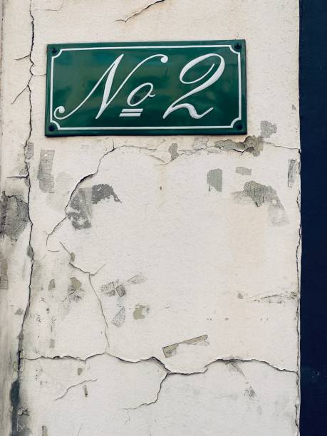 istock House number 2 on damaged white wall 1167581786