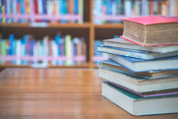 istock Book stack in the library room with copy space for business and education background.back to school concept 1167582072