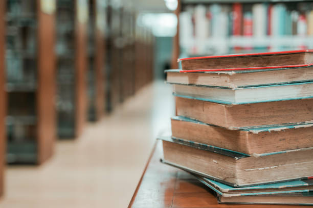 istock Book stack in the library room with copy space for business and education background.back to school concept 1167582828