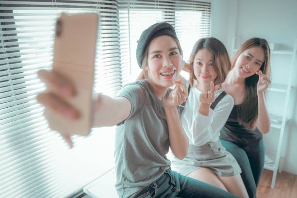 istock Young Asian friend take a selfie 1167582883