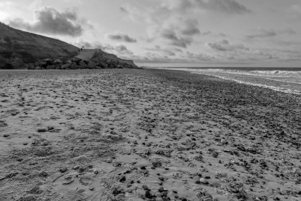 istock Darkening skies over a gloomy Happisburgh beach 1167583239