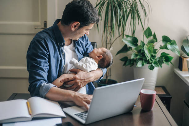 Single father working from home Single father working from home. He is catching a deadline candid bonding connection togetherness stock pictures, royalty-free photos & images