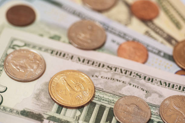 istock United States Dollar (USD) bills and coins 1167583638