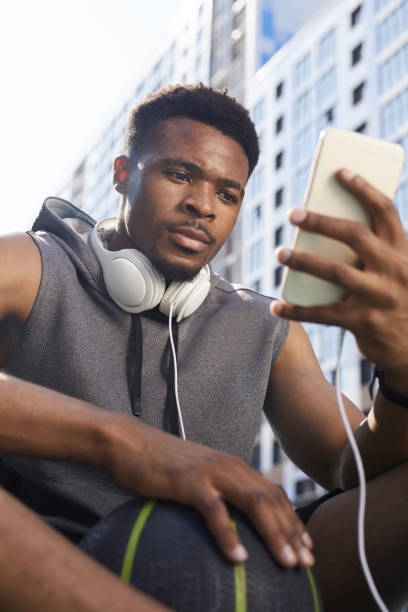 istock African Man Using Smartphone Outdoors 1167584711
