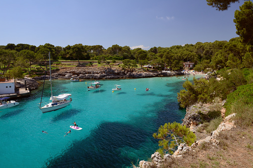 image of sailing yacht in a beautiful blue lagoon, Mallorca, Spain