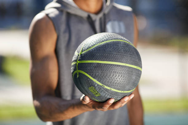Man Holding Ball Closeup