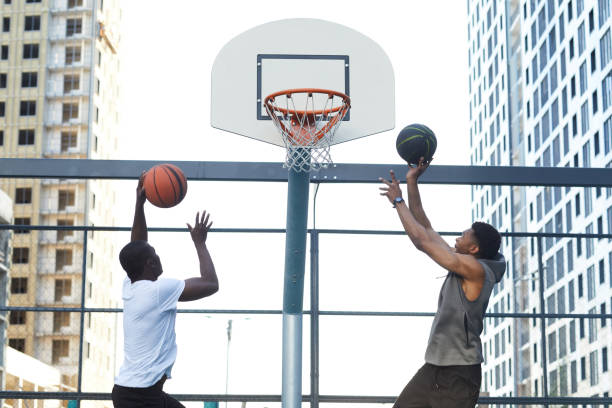 istock Guys Scoring Goal in Basketball 1167585547