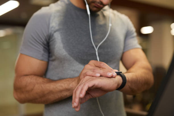 istock Man Using Smartwatch in Gym Closeup 1167586957