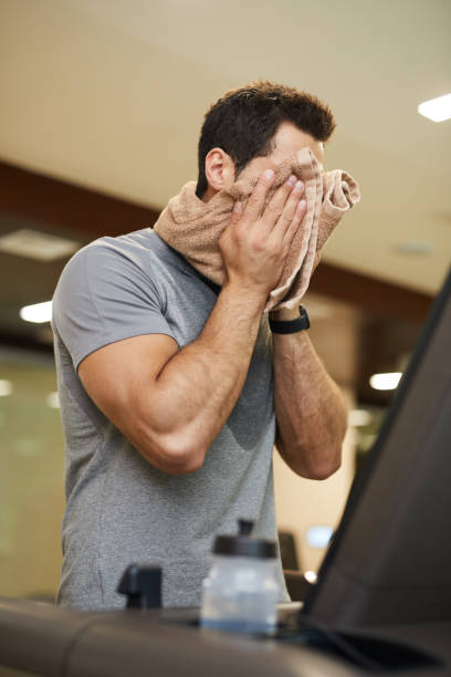 istock Man Wiping Sweat in Workout 1167586985