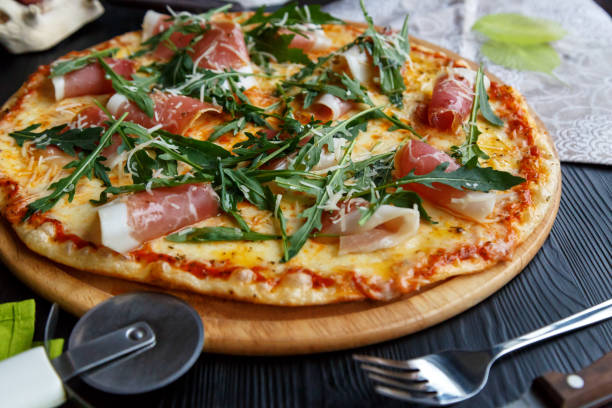 istock Pizza with bacon, cheese and greens 1167588247