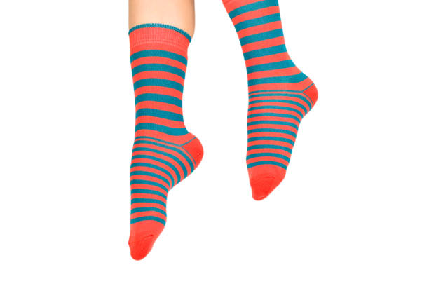 istock Woman in orange socks isolated on white background. Top view. 1167588462