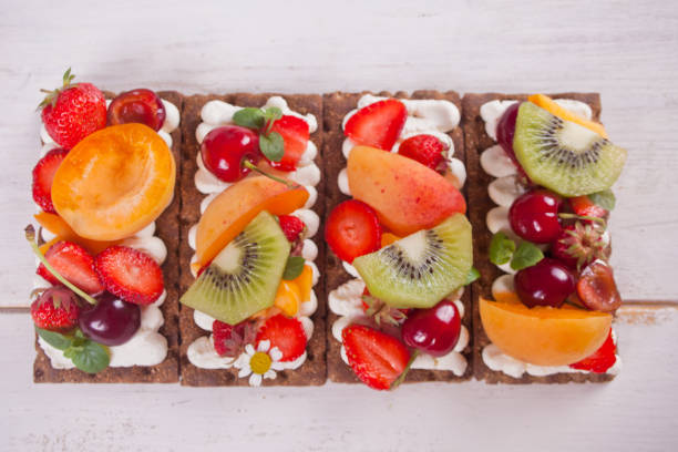 istock Crisp bread with creme cheese, fruit and berries 1167589119