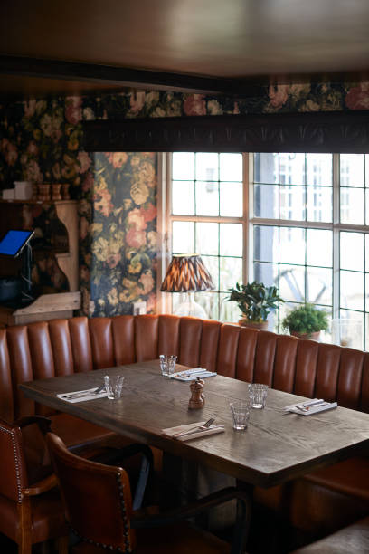 istock Interior Of Traditional English Pub With Table Set For Meal 1167590171