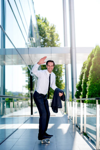 istock Businessman skateboarding 1167591873
