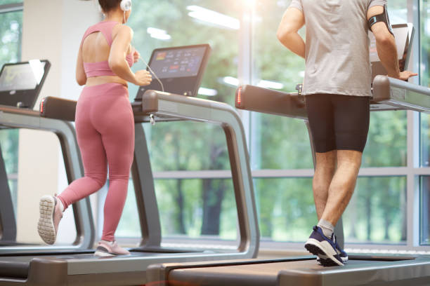 istock People Running on Treadmill in Heath Club 1167592981