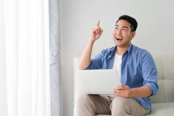istock Asian man in living room 1167593046