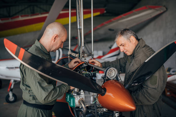 istock Two airplane mechanics repairing airplane 1167596227
