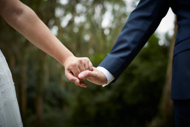 istock Heterosexual couple holding hands. Outdoors 1167602940