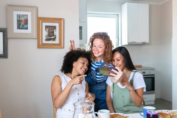 istock Mixed Races Female Friends Making Selfie 1167603025