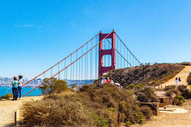 People /Tourists sightseeing overlooking Golden Gate Bridge in San Francisco, California and coastal landscape from Battery Spencer near Sausalito city in Marin County San Francisco, California - October 06 2017: People /Tourists sightseeing overlooking Golden Gate Bridge and coastal landscape from Battery Spencer near Sausalito city in Marin County sausalito stock pictures, royalty-free photos & images