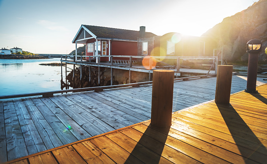 traditional red rorbu in the sunset, Norway Lofoten, Skrova island,