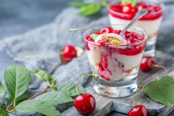 istock Light cheesecake with cherry jelly in a glass. 1167605639