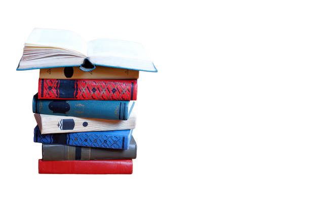 istock Stack of old color books, isolated on white background. Opened book above. 1167606321