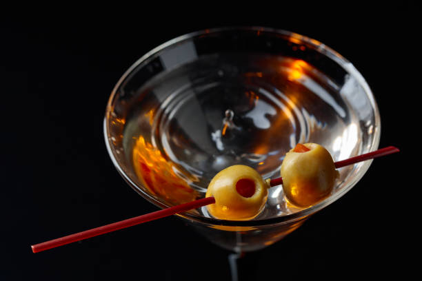 martini cocktail with green olives. - action alcohol alcoholism bar imagens e fotografias de stock