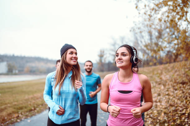istock Friends Enjoying Running In The Park 1167609531