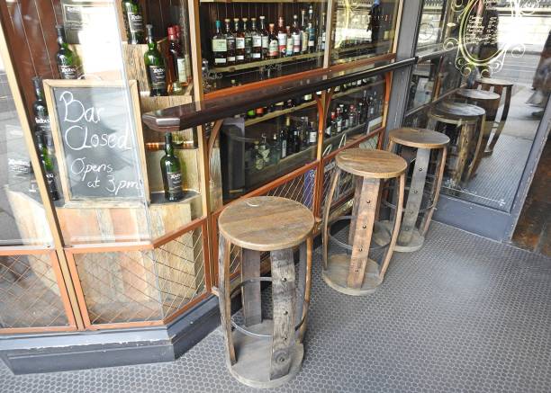 Wooden stools 26th July 2019, Dublin, Ireland. Wooden stools outside the Dingle Whiskey Bar in Nassau St, Dublin. nassau street stock pictures, royalty-free photos & images