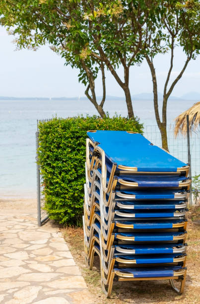 istock Large group of Lounge chairs on the beach 1167611775
