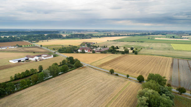 istock Agricultural fields and farm buildings - aerial view 1167617348