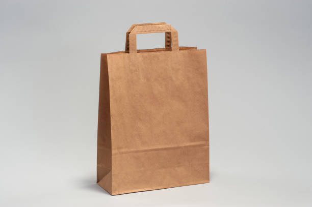 istock Kraft brown paper shopping bag 1167618453