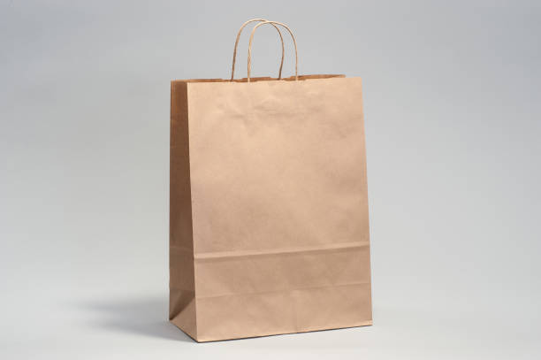 istock Kraft brown paper shopping bag 1167618454