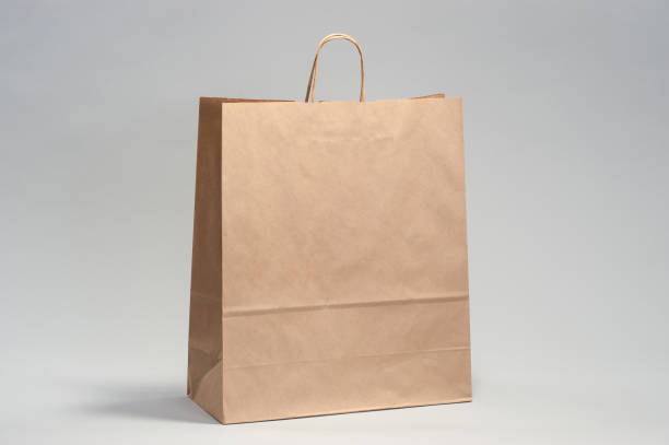 istock Kraft brown paper shopping bag 1167618455