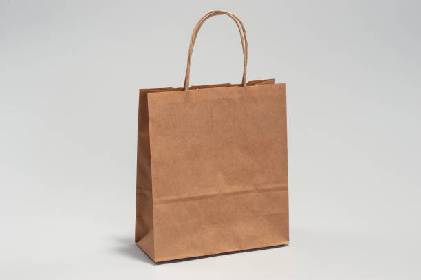 istock Kraft brown paper shopping bag 1167618459