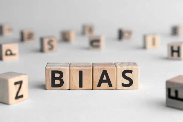 Photo of Bias - word from wooden blocks with letters