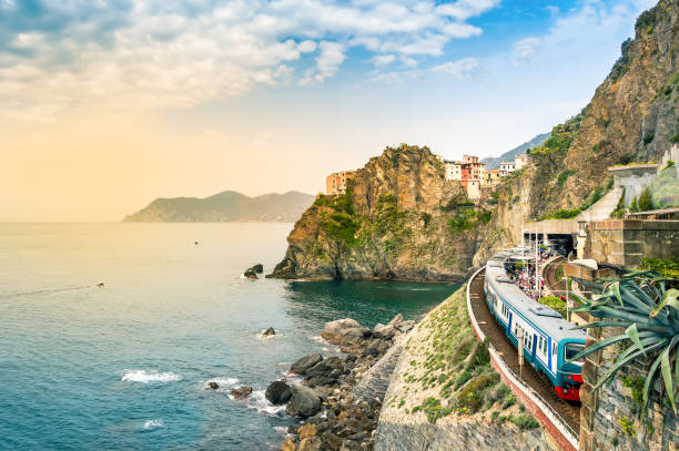 Manarola, Cinque Terre - train station in famous village with colorful houses on cliff over sea in Cinque Terre Manarola, Cinque Terre - train station in small village with colorful houses on cliff overlooking sea. Cinque Terre National Park with rugged coastline is famous tourist destination in Liguria, Italy liguria photos stock pictures, royalty-free photos & images