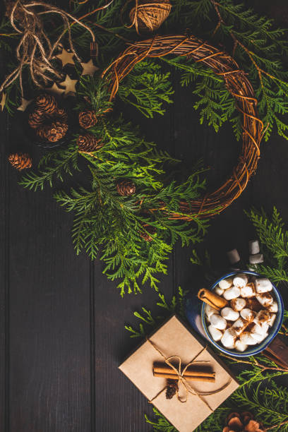 istock Christmas composition on dark background. Christmas wreath, cocoa, gift box and christmas decoration background. 1167623154