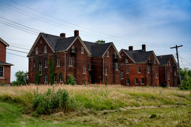 Condemned Buildings On A Military Compound Outside Detroit Michigan Abandoned dilapidated old buildings on an old fort complex near Detroit detroit ruins stock pictures, royalty-free photos & images