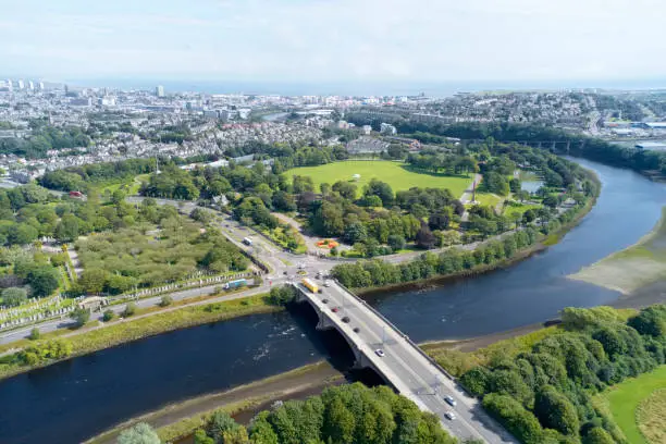 Aerial view of Aberdeen as River Dee flows in a curve to the North Sea showing Duthie Park with bridge and traffic from south uk