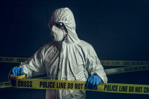 portrait of forensic scientist at crime scene - coroner imagens e fotografias de stock